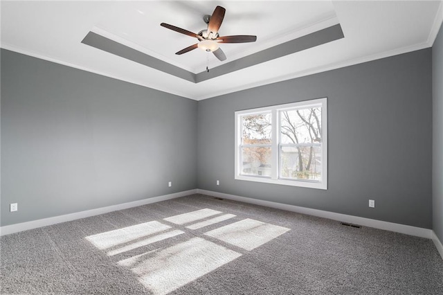19455 W 114th Ter, Olathe, KS 66061 - carpeted spare room featuring a raised ceiling, ornamental molding, and a ceiling fan
