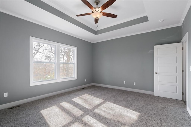 19455 W 114th Ter, Olathe, KS 66061 - spare room featuring carpet, ceiling fan, ornamental molding, a tray ceiling, and a smoke detector