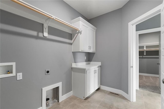 19455 W 114th Ter, Olathe, KS 66061 - laundry area featuring hookup for an electric dryer, washer hookup, and cabinet space