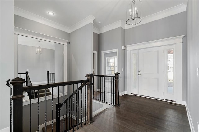 19455 W 114th Ter, Olathe, KS 66061 - foyer entrance featuring wood finished floors, crown molding, and a chandelier
