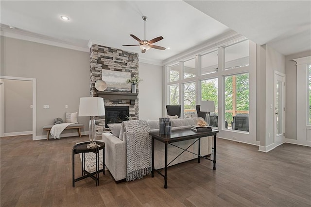 19345 W 114th Ter, Olathe, KS 66061 - living area with a ceiling fan, crown molding, a stone fireplace, dark wood finished floors, and recessed lighting