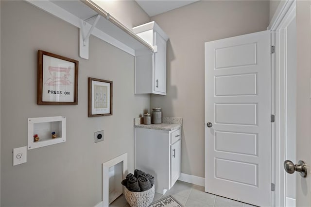 19345 W 114th Ter, Olathe, KS 66061 - washroom featuring electric dryer hookup, washer hookup, light tile patterned floors, and cabinet space