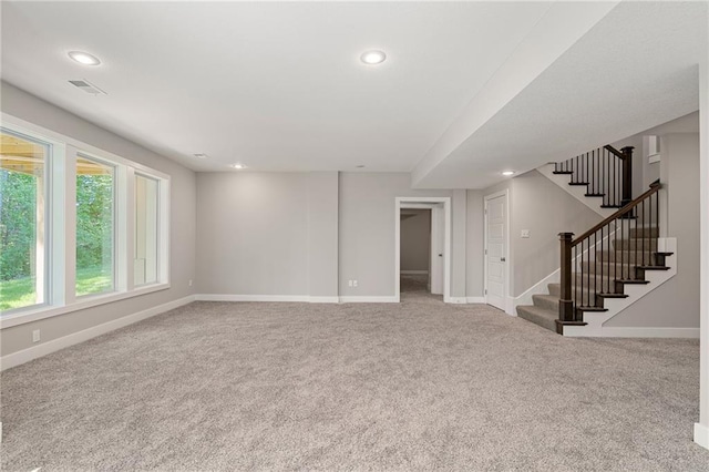 19345 W 114th Ter, Olathe, KS 66061 - unfurnished living room with carpet, recessed lighting, and stairs
