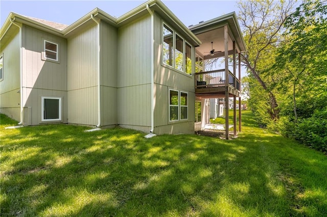 19345 W 114th Ter, Olathe, KS 66061 - rear view of house with ceiling fan, a lawn, and a wooden deck