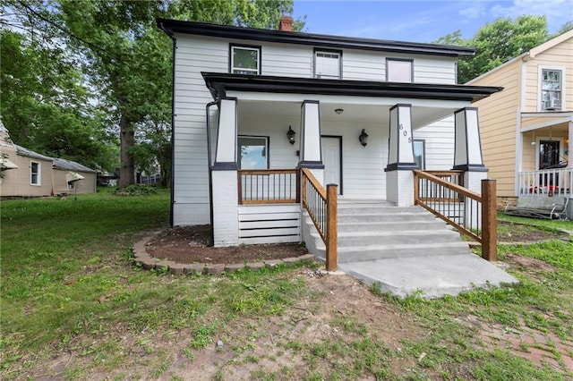 605 Oak St, Leavenworth, KS 66048 - view of front of house with a chimney and covered porch