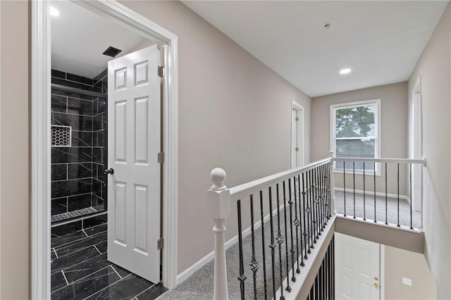 605 Oak St, Leavenworth, KS 66048 - corridor with an upstairs landing, dark marble finish flooring, and recessed lighting