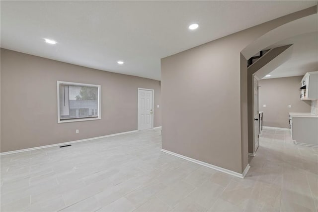 605 Oak St, Leavenworth, KS 66048 - unfurnished room with arched walkways and recessed lighting