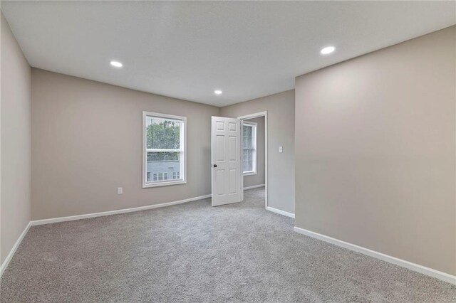 605 Oak St, Leavenworth, KS 66048 - carpeted spare room featuring baseboards and recessed lighting