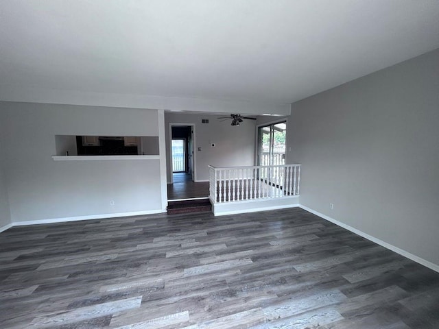 419 W 104th St Unit D, Kansas City, MO 64114 - unfurnished living room featuring wood finished floors and ceiling fan