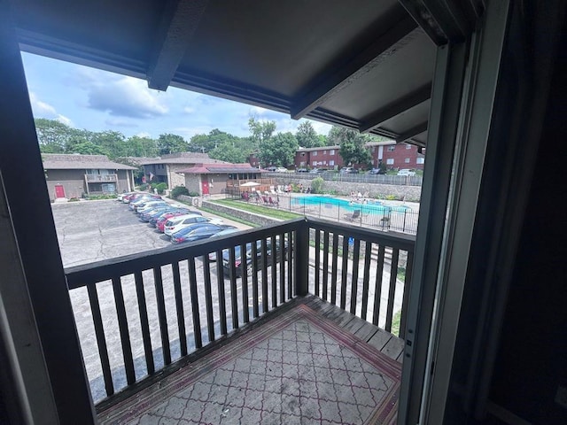 419 W 104th St Unit D, Kansas City, MO 64114 - balcony featuring view of pool area