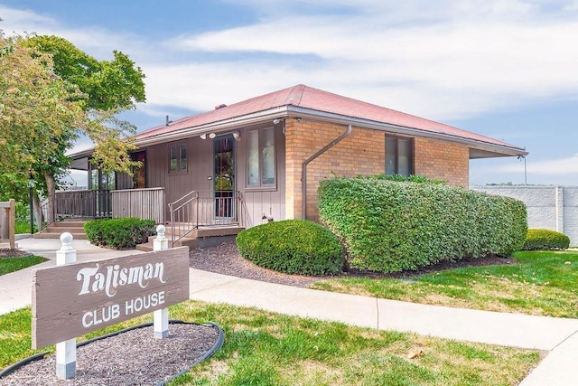 419 W 104th St Unit D, Kansas City, MO 64114 - view of front of property with brick siding and covered porch