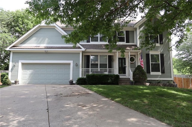 11669 S Parkwood Dr, Olathe, KS 66061 - view of front of house featuring covered porch, driveway, a garage, and roof with shingles