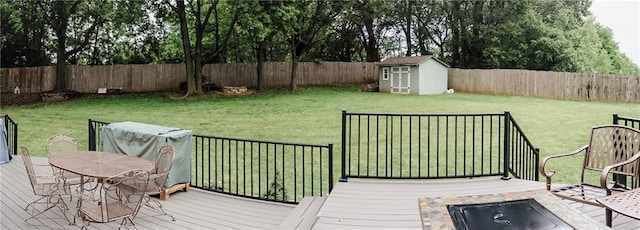 11669 S Parkwood Dr, Olathe, KS 66061 - wooden deck featuring a fenced backyard and a storage shed