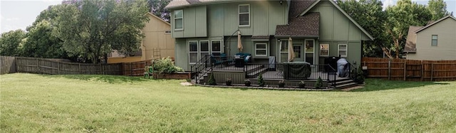 11669 S Parkwood Dr, Olathe, KS 66061 - rear view of property featuring board and batten siding, a fenced backyard, and a wooden deck