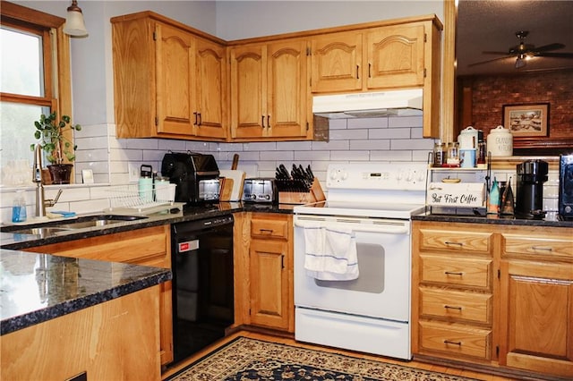 11669 S Parkwood Dr, Olathe, KS 66061 - kitchen with under cabinet range hood, dishwasher, white range with electric stovetop, ceiling fan, and tasteful backsplash