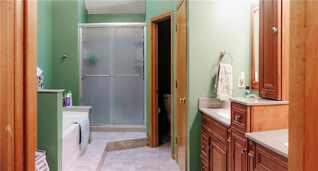 11669 S Parkwood Dr, Olathe, KS 66061 - full bathroom with a shower stall, vanity, and a garden tub