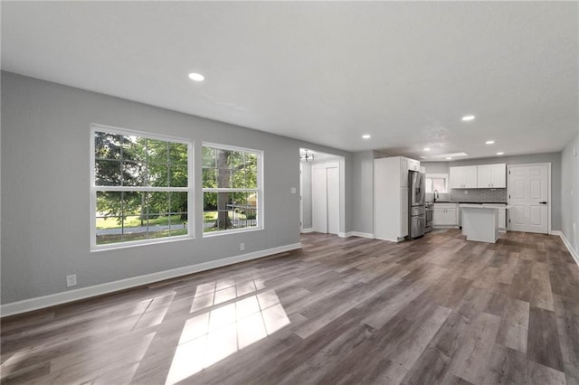 2101 Spruce St, Leavenworth, KS 66048 - unfurnished living room featuring recessed lighting and dark wood finished floors
