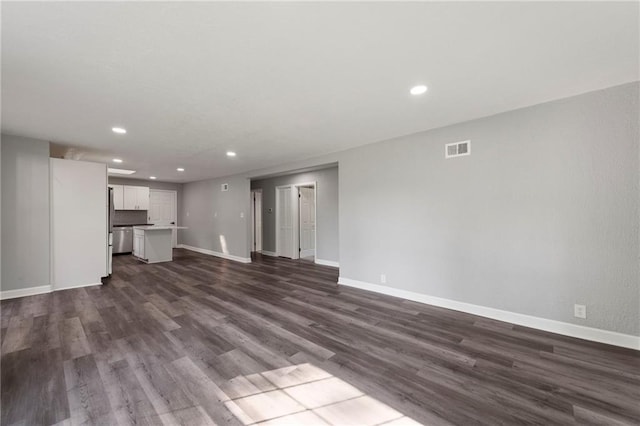 2101 Spruce St, Leavenworth, KS 66048 - unfurnished living room featuring dark wood-type flooring and recessed lighting