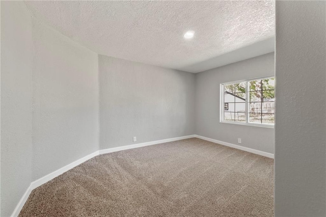 2101 Spruce St, Leavenworth, KS 66048 - empty room with a textured ceiling and carpet floors