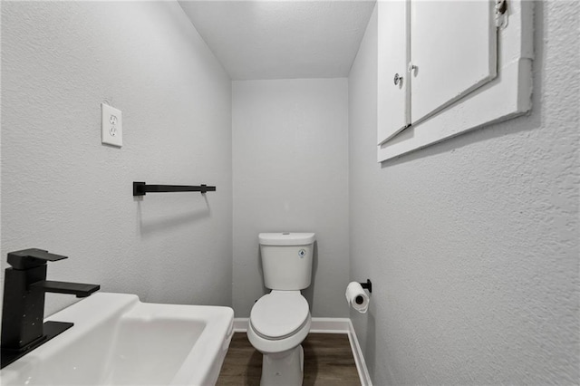 2101 Spruce St, Leavenworth, KS 66048 - bathroom featuring wood finished floors and baseboards