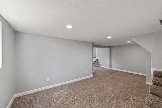 2101 Spruce St, Leavenworth, KS 66048 - finished basement with carpet, stairs, and recessed lighting