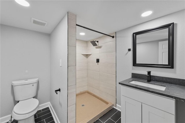 2101 Spruce St, Leavenworth, KS 66048 - full bath with tile patterned floors, vanity, a tile shower, and recessed lighting