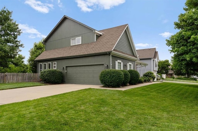 12499 S Marion St, Olathe, KS 66061 - view of side of property featuring an attached garage, concrete driveway, and roof with shingles