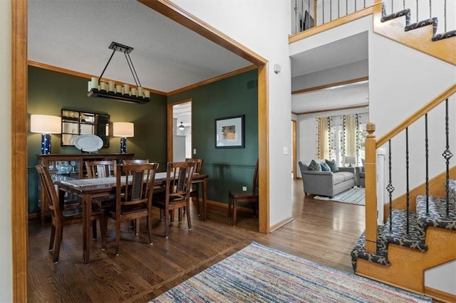 12499 S Marion St, Olathe, KS 66061 - dining space with stairs, wood finished floors, and ornamental molding