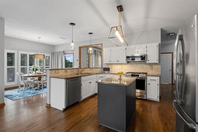 12499 S Marion St, Olathe, KS 66061 - kitchen with appliances with stainless steel finishes, backsplash, and white cabinets