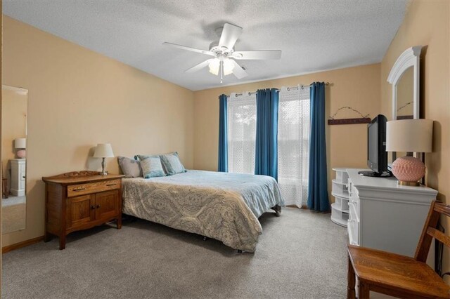 12499 S Marion St, Olathe, KS 66061 - bedroom with light colored carpet, a textured ceiling, and a ceiling fan