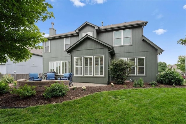 12499 S Marion St, Olathe, KS 66061 - back of house with a lawn, a chimney, a patio area, and outdoor lounge area