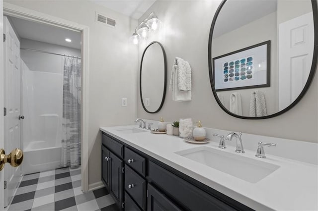 12499 S Marion St, Olathe, KS 66061 - full bath with tile patterned floors, double vanity, and shower / tub combo