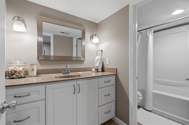 12499 S Marion St, Olathe, KS 66061 - full bathroom featuring vanity and shower / bath combo