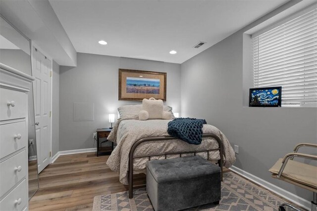 12499 S Marion St, Olathe, KS 66061 - bedroom featuring wood finished floors and recessed lighting