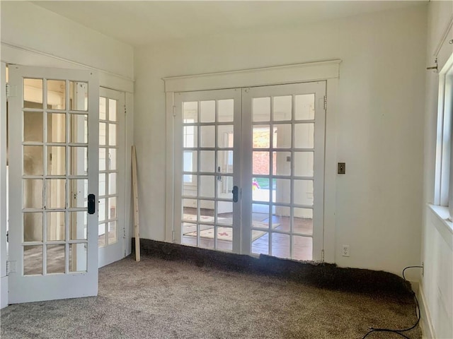 326 W Walnut St, Nevada, MO 64772 - entryway featuring french doors and carpet flooring