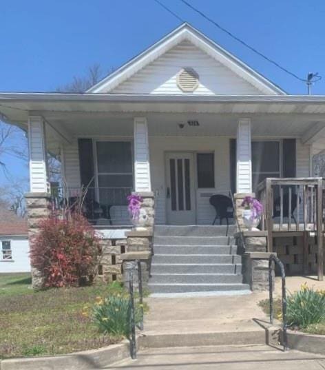 326 W Walnut St, Nevada, MO 64772 - view of front of house featuring covered porch