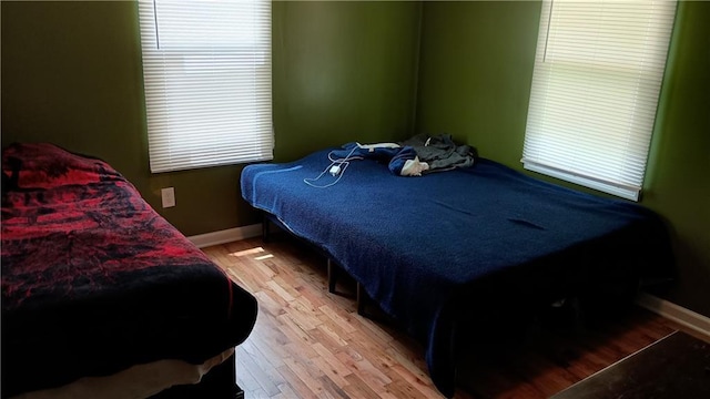 107 N 20th St, Leavenworth, KS 66048 - bedroom featuring light wood-type flooring and baseboards
