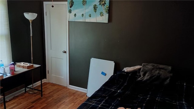 107 N 20th St, Leavenworth, KS 66048 - bedroom featuring wood finished floors and a desk