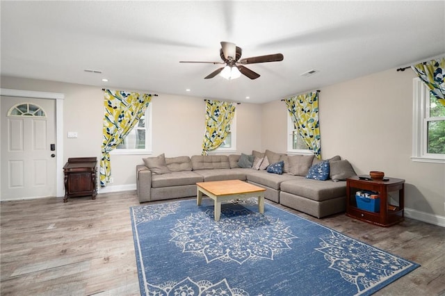 118 Village St, Tonganoxie, KS 66086 - living room featuring a ceiling fan, wood finished floors, and recessed lighting