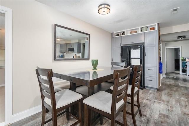 118 Village St, Tonganoxie, KS 66086 - dining room featuring wood finished floors