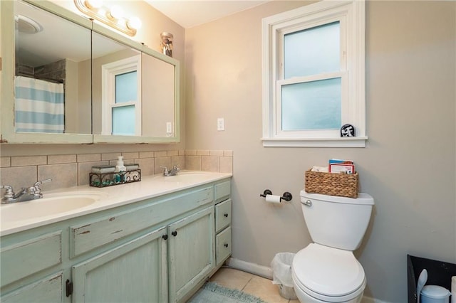 118 Village St, Tonganoxie, KS 66086 - full bath with double vanity, decorative backsplash, tile patterned flooring, and a shower with shower curtain
