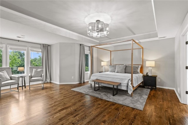 5209 W 161st St, Overland Park, KS 66085 - bedroom featuring a tray ceiling, wood finished floors, and a chandelier