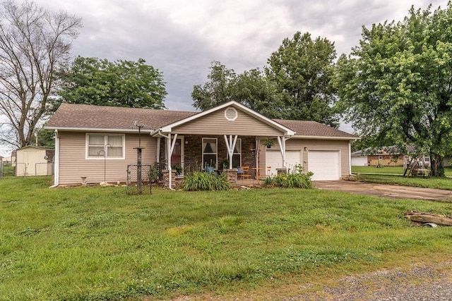106 S Clark St, Adrian, MO 64720 - ranch-style house with a porch, a garage, a front yard, driveway, and a storage shed