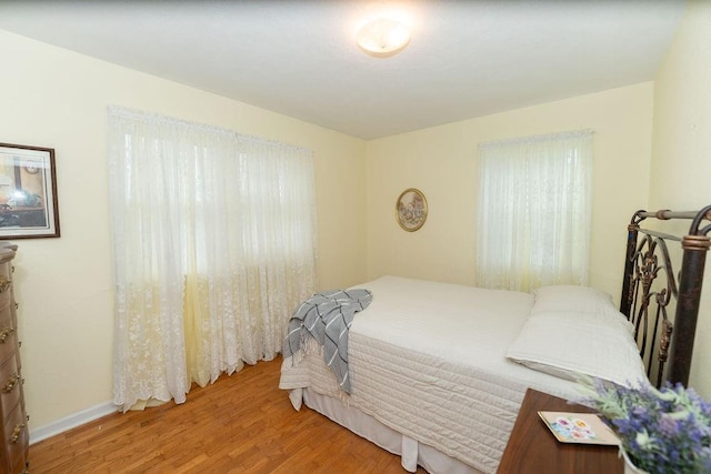 106 S Clark St, Adrian, MO 64720 - bedroom with light wood-style flooring and baseboards
