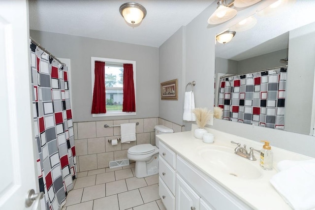 106 S Clark St, Adrian, MO 64720 - full bathroom with tile walls, tile patterned floors, vanity, and a shower with curtain