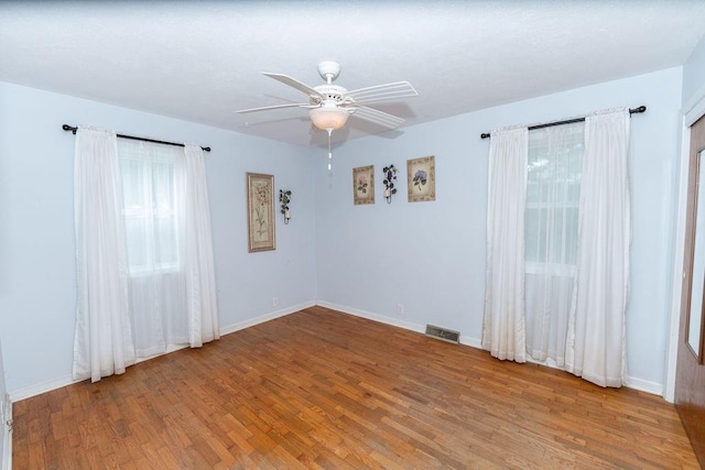 106 S Clark St, Adrian, MO 64720 - unfurnished room with wood finished floors and a ceiling fan