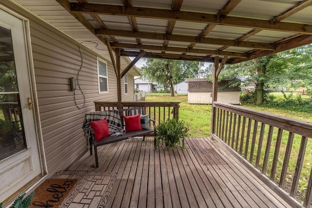 106 S Clark St, Adrian, MO 64720 - deck featuring a storage shed and a yard