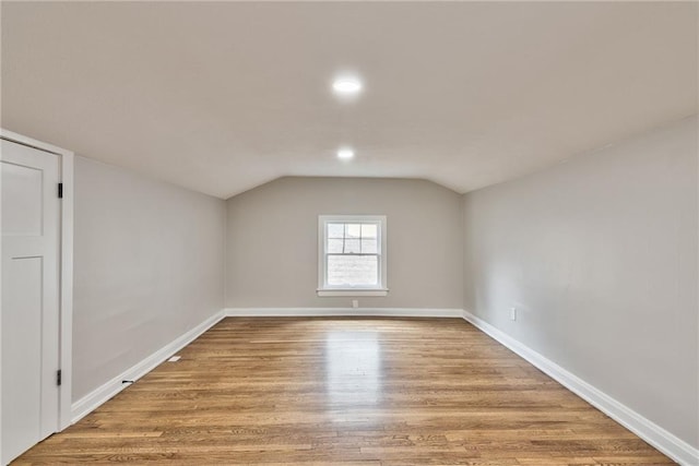 5740 Oak St, Kansas City, MO 64113 - bonus room with vaulted ceiling, light wood finished floors, and recessed lighting