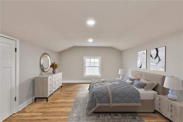 5740 Oak St, Kansas City, MO 64113 - bedroom with lofted ceiling, light wood-style floors, and recessed lighting