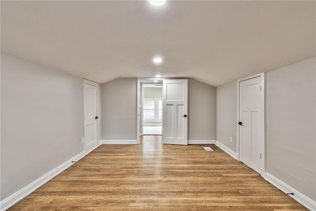 5740 Oak St, Kansas City, MO 64113 - additional living space featuring light wood-style floors, lofted ceiling, and recessed lighting